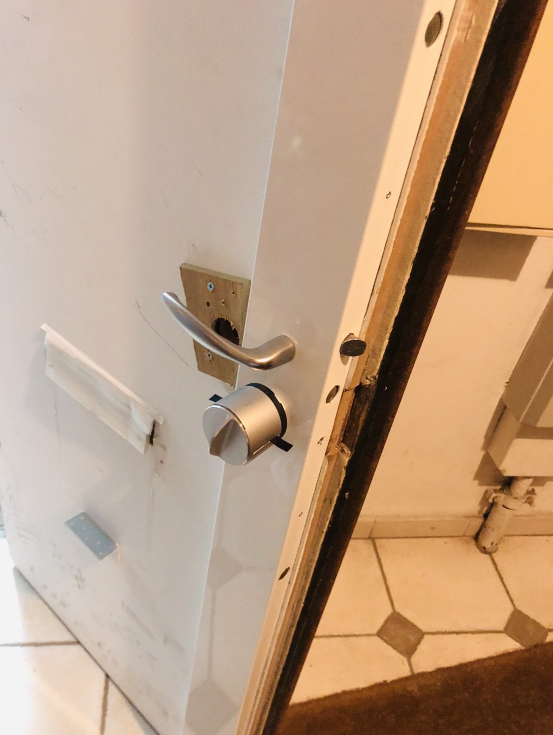 Man using mobile phone to control various devices in the house, Smart home technology concept